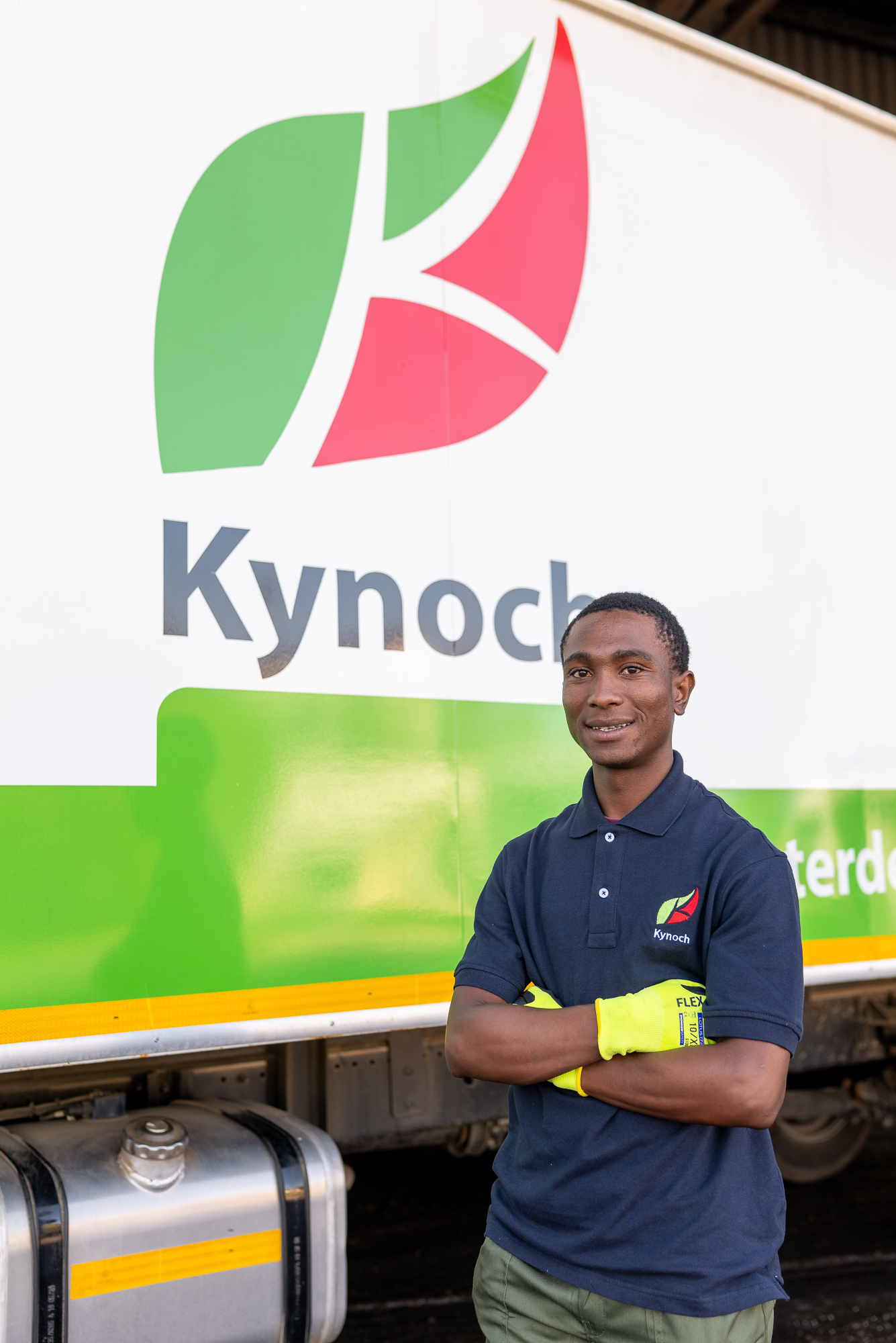 Kynoch team member standing beside a branded delivery truck