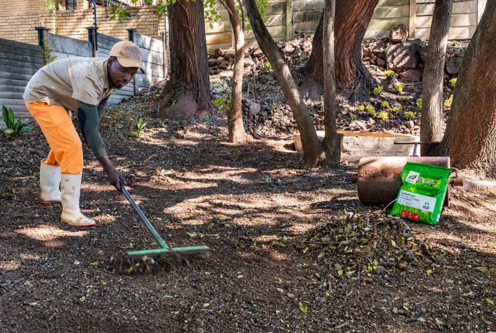 Preparing and clearing soil before laying a new lawn